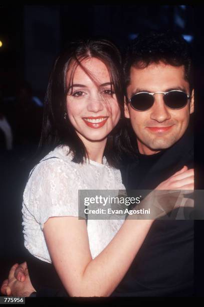 Director Charles Kanganis hugs actress Eliza Dushku at a charity benefit screening of their movie "Race the Sun" March 16, 1996 in New York City. The...