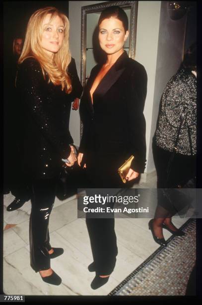 Actress Yasmine Bleeth and an unidentified woman attend the grand opening of a new Versace Boutique on 5th Avenue October 26, 1996 in New York City....