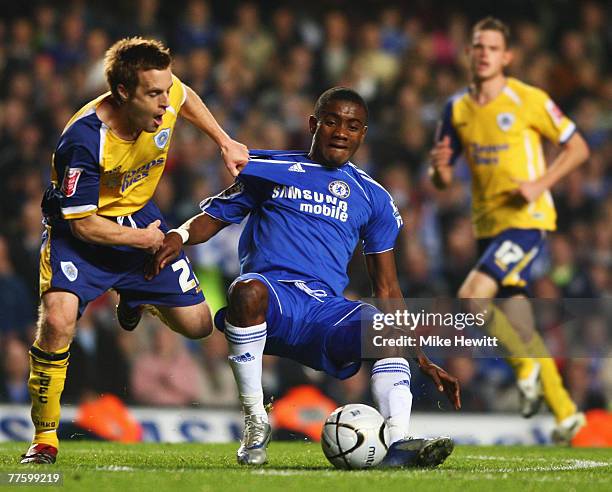 Salomon Kalou of Chelsea battles with Alan Maybury of Leicester City during the Carling Cup Fourth Round match between Chelsea and Leicester City at...