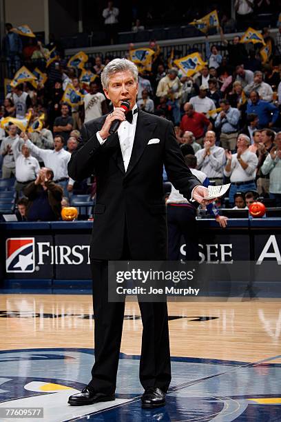 Professional ring announcer Michael Buffer announces the starting lineup for the Memphis Grizzlies and San Antonio Spurs during the season opener...