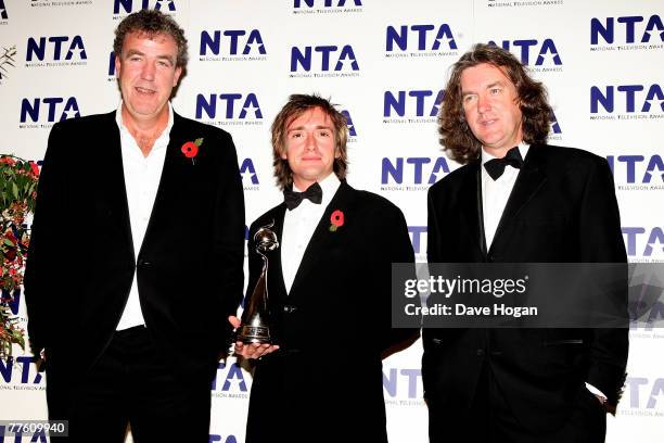 'Top Gear' presenters Jeremy Clarkson, Richard Hammond and James May pose with the award for Most Popular Factual Programme at the National...