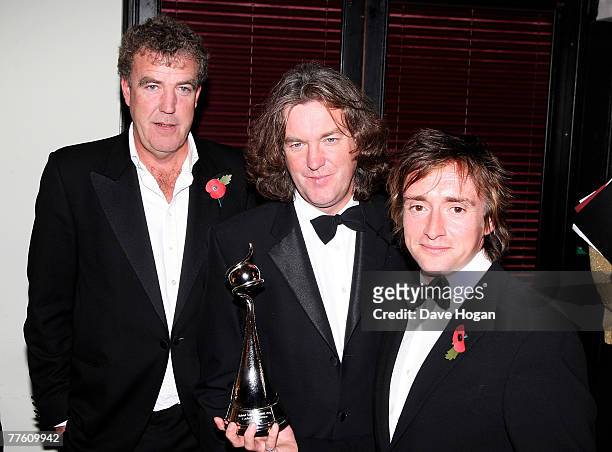 'Top Gear' presenters Jeremy Clarkson, James May and Richard Hammond pose with the award for Most Popular Factual Programme at the National...