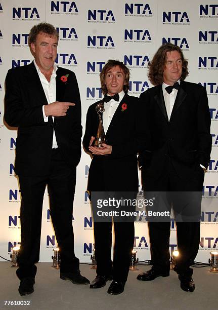 'Top Gear' presenters Jeremy Clarkson, Richard Hammond and James May pose with the award for Most Popular Factual Programme in the Awards Room at the...