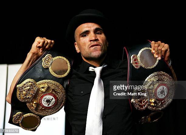 Anthony Mundine displays his world title belts at a press conference held to announce the next bout in his World Title defence against Jose Alberto...