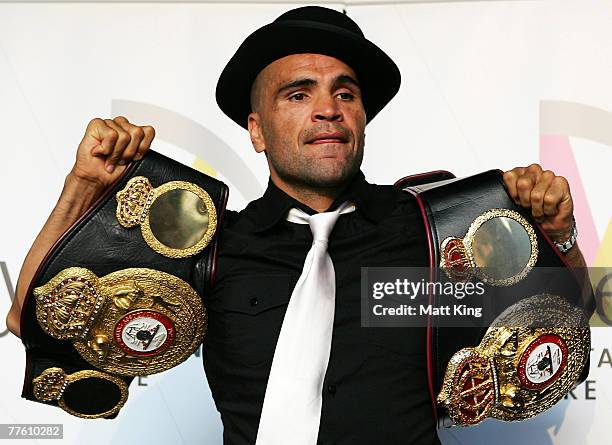 Anthony Mundine displays his world title belts at a press conference held to announce the next bout in his World Title defence against Jose Alberto...