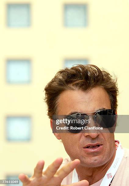 Ex formula one driver Jean Alesi, who is competeing in the Speedcar support race is seen in the pit paddock prior to practice for the Desert 400...