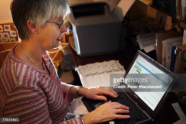 Pensioner Mary Devlin uses a laptop computer to look at the Saga Zone website on November 1, 2007 in London, England. A social networking site for...
