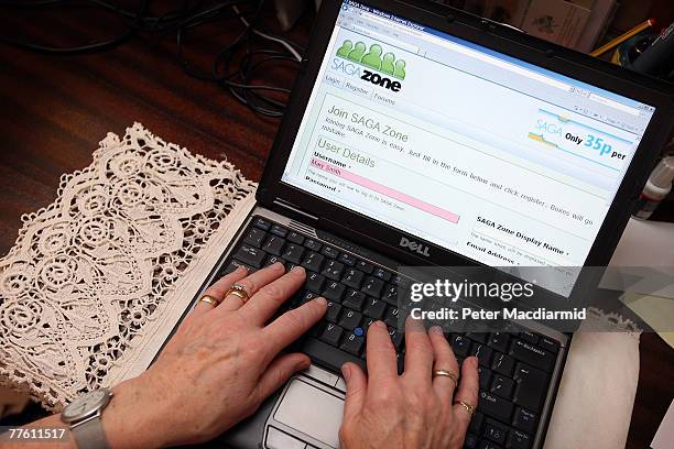 Pensioner Mary Devlin uses a laptop computer to look at the Saga Zone website on November 1, 2007 in London, England. A social networking site for...