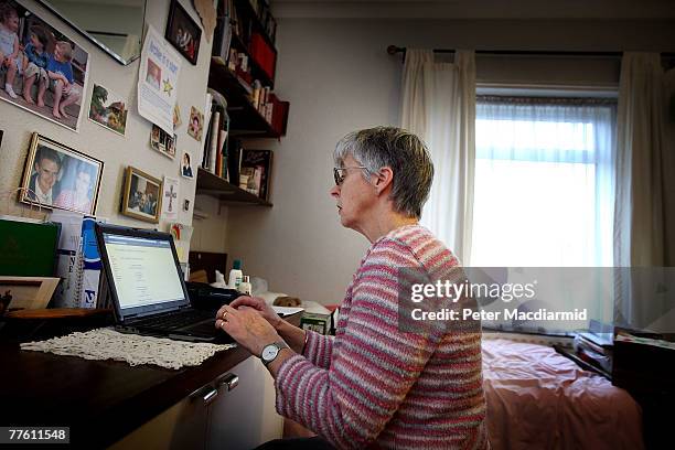 Pensioner Mary Devlin uses a laptop computer at home on November 1, 2007 in London, England. A social networking site for the over 50s has been...