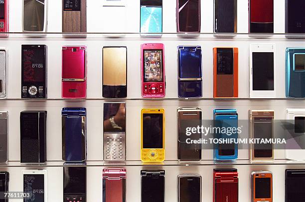 DoCoMo's new mobile phones on display during a press preview in Tokyo, 01 November 2007. NTT DoCoMo announced 10 new 905i serires and 13 of 705i...