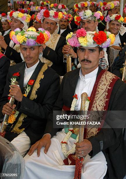 Yemeni bridegrooms take part in a mass wedding celebration in the Yemeni town of Attawila, 80 kms west of the capital Sanaa, 01 November 2007. The...