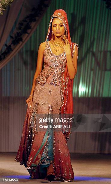 Pakistani model showcases a creation during a fashion show in Lahore, late 31 October 2007. Some 14 designers participated in the fashion show...