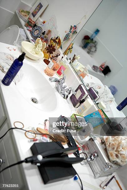 disorganized bathroom vanity counter - bathroom vanity fotografías e imágenes de stock