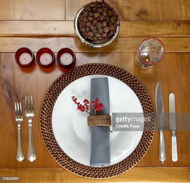 place setting on wooden dining table - napkin ring stock pictures, royalty-free photos & images