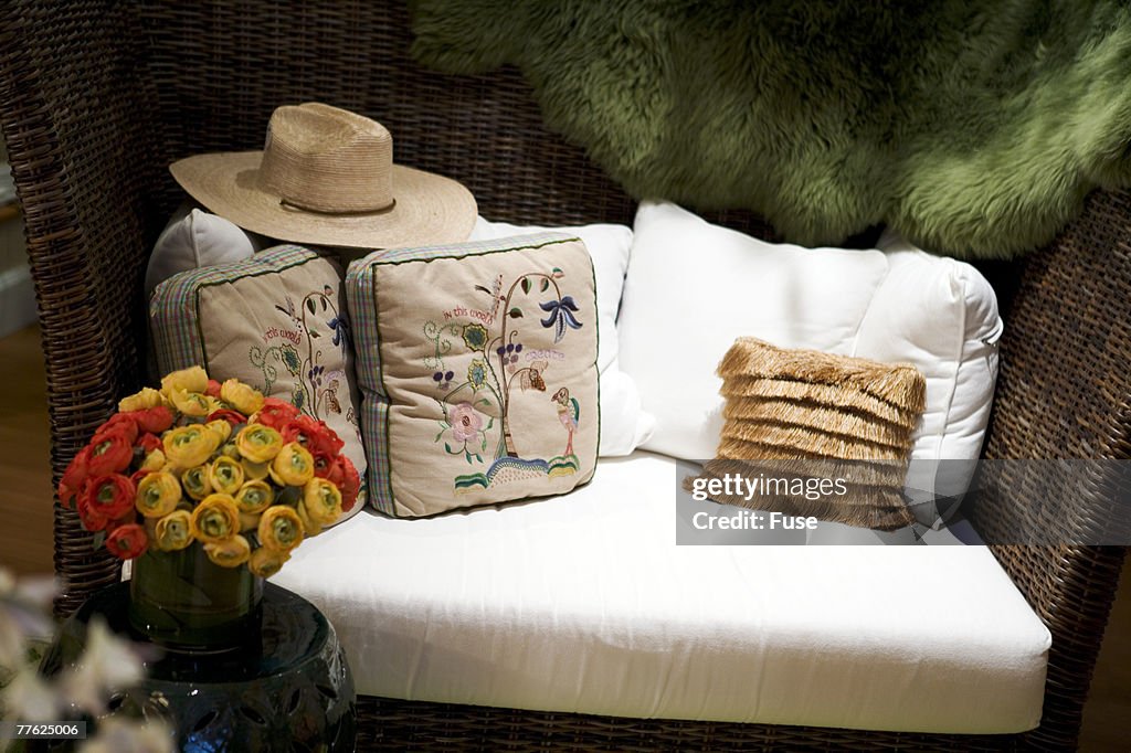 Cushions and pillows on an upholstered country bench