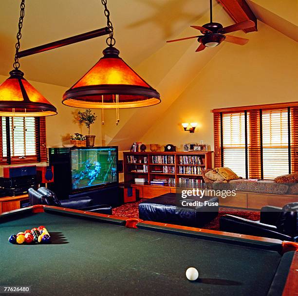 family room with pool table - man cave stock pictures, royalty-free photos & images