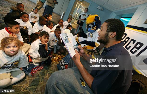 David Harrison of the Indiana Pacers and the Pacers mascot, Boomer, read to students from the Pacers Learning Centers as the Pacers tipped off their...