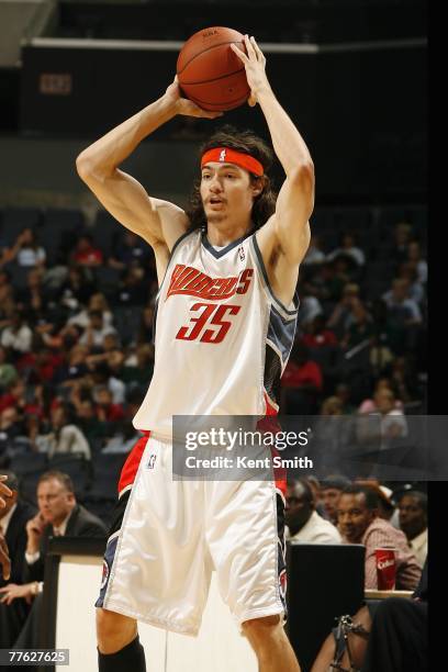Adam Morrison of the Charlotte Bobcats looks to pass against the Atlanta Hawks during the game on October 18, 2007 at the Charlotte Bobcats Arena in...