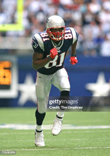 Wide receiver Randy Moss of the New England Patriots runs down field in a game against the Dallas Cowboys at Texas Stadium on October 14, 2007 in...