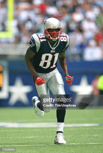 Wide receiver Randy Moss of the New England Patriots runs down field in a game against the Dallas Cowboys at Texas Stadium on October 14, 2007 in...