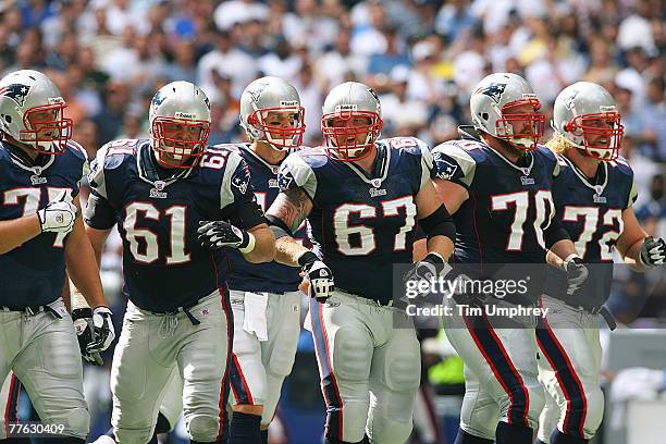 The New England Patriots offense walks to the line of scrimmage in a game against the Dallas Cowboys at Texas Stadium on October 14, 2007 in Irving,...