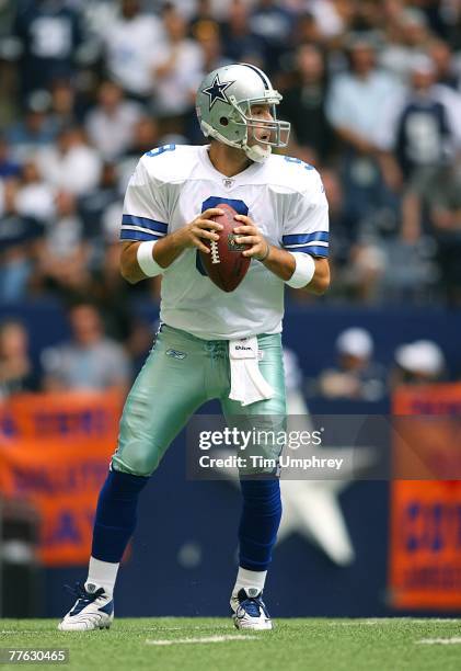 Quarterback Tony Romo of the Dallas Cowboys drops back to pass in a game against the New England Patriots at Texas Stadium on October 14, 2007 in...