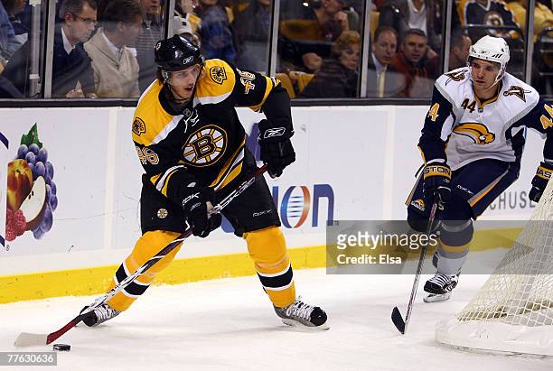 David Krejci of the Boston Bruins heads for the net as Andrej Sekera of the Buffalo Sabres defends on November 1, 2007 at the TD Banknorth Garden in...