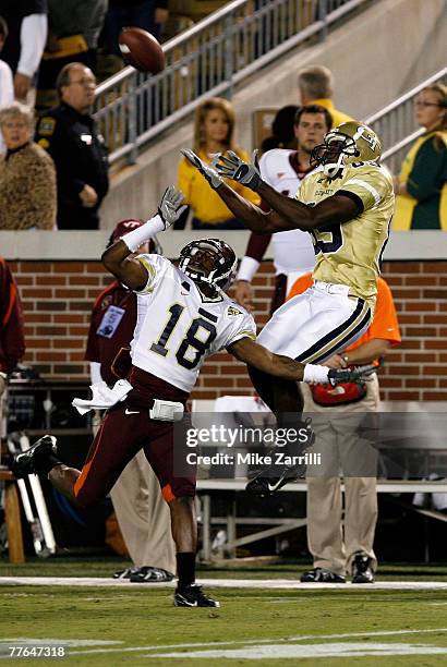 Wide receiver James Johnson of the Georgia Tech Yellow Jackets goes up for a first quarter reception over cornerback Brandon Flowers of the Virginia...