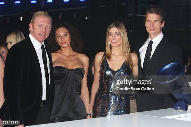 Former tennis star Boris Becker with his girlfriend Sharlely Kerssenberg and soccer player Jens Lehmann with his wife Conny attend the show at the...