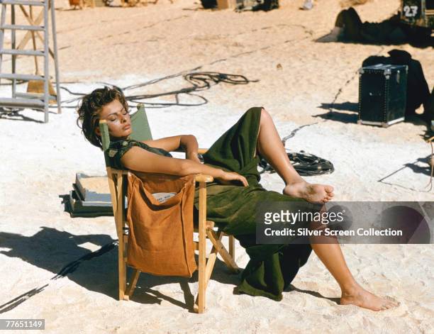 Italian actress Sophia Loren relaxes on the Libyan set of the desert adventure film 'Legend of the Lost', 1957.