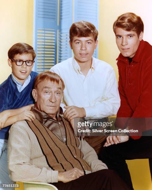The cast of the television series 'My Three Sons', circa 1965. From left to right, Barry Livingston, Stanley Livingston and Don Grady, with William...