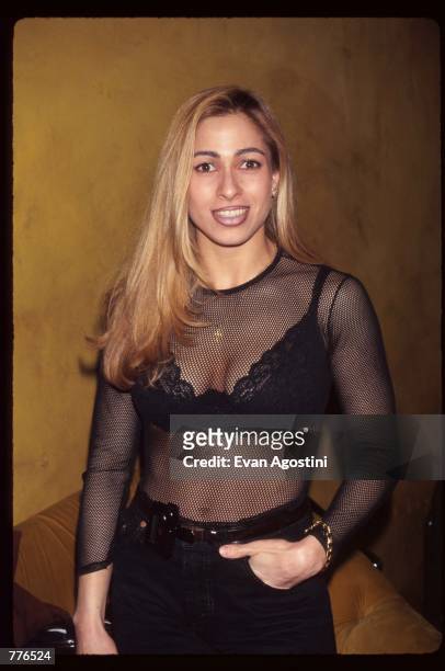 Former New York police officer Carol Shaya, who posed nude for Playboy stands April 19, 1996 in New York City. Carmen Electra had a party thrown in...