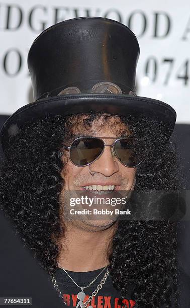 Slash guitarist for Guns N' Roses and Velvet Revolver signs copies of his book "Slash" at Bookends Bookstore on November 1, 2007 in Ridgewood, New...