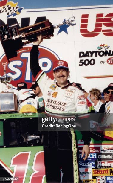 Dale Jarrett hoists the trophy symbolizing his victory in the 1993 Daytona 500. Jarrett?s win was his first of three career Daytona 500 wins.