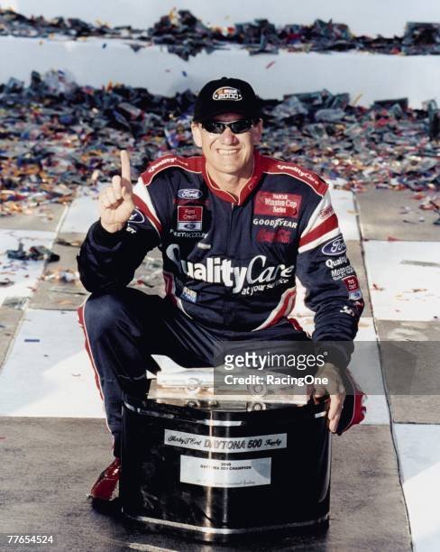Dale Jarrett poses with the Harley J. Earl Daytona 500 Trophy after his win in the 2000 race. The trophy is named for pioneer automotive stylist Earl.