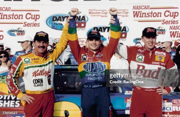 Daytona 500 1997 winner Jeff Gordon celebrates with teammates Terry Labonte and Ricky Craven following their sweep of the first three finishing...