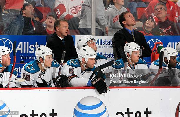 Head coach Ron Wilson and assistant coach Tim Hunter of the San Jose Sharks look on from behind the bench against the Detroit Red Wings during the...