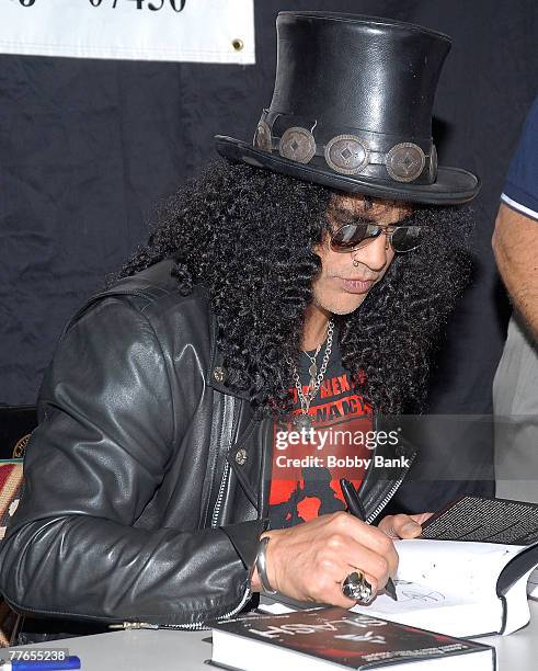 Slash guitarist for Guns N' Roses and Velvet Revolver signs copies of his book "Slash" at Bookends Bookstore on November 1, 2007 in Ridgewood, New...