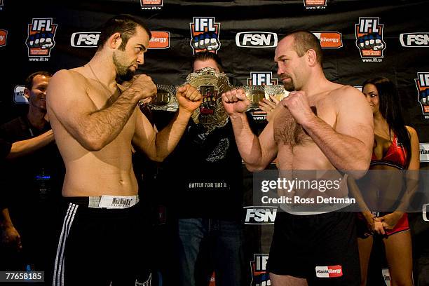Alex Schoenauer of the Anacondas poses with Vladimir Matyushenko of the Sabres during the weigh-in for the IFL World Grand Prix at the Buffalo Wild...