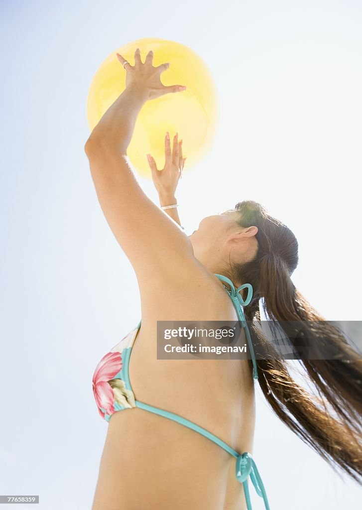 Woman playing beach volleyball