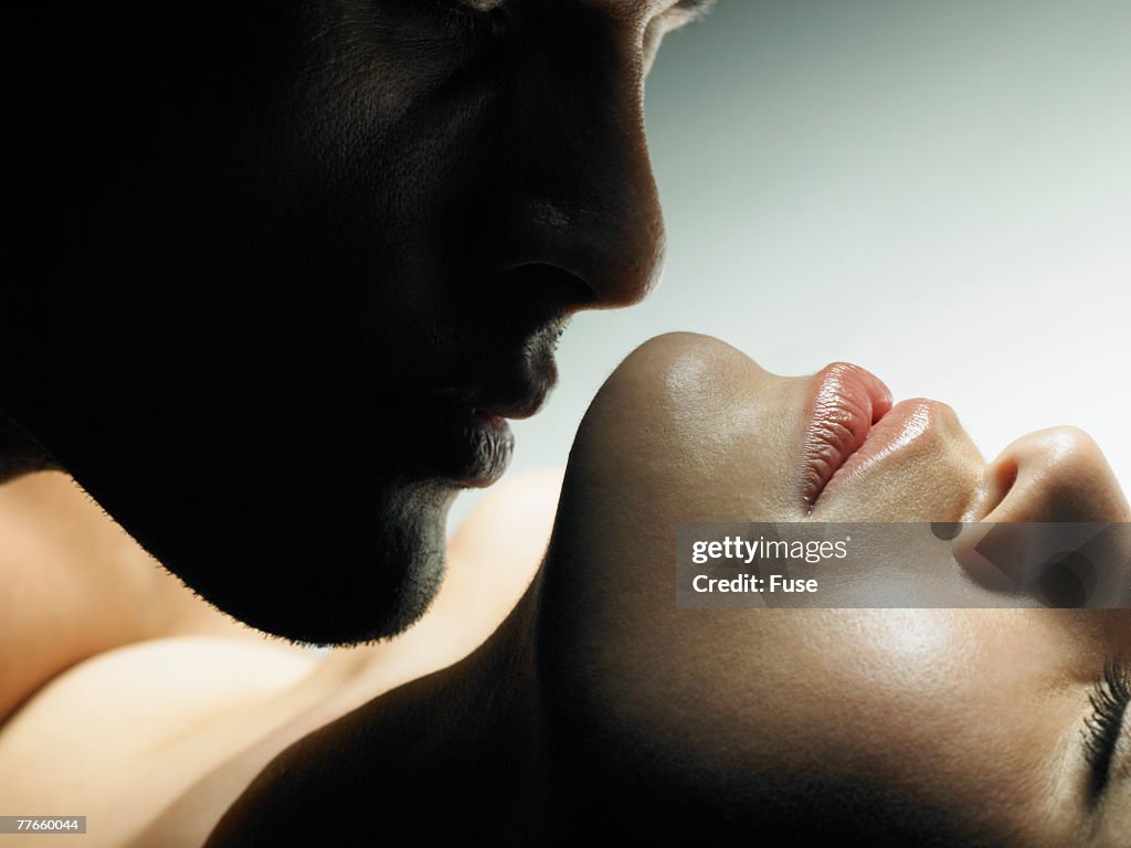 Man Kissing a Woman
