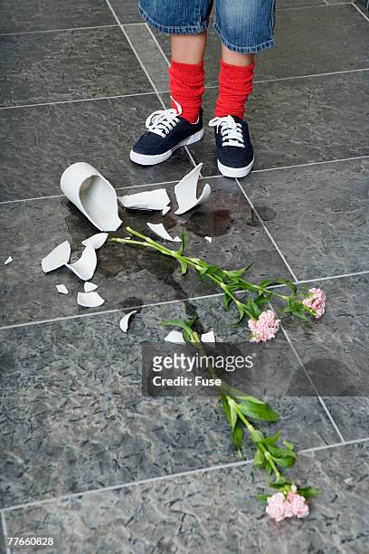 boy with broken vase - broken vase stock pictures, royalty-free photos & images