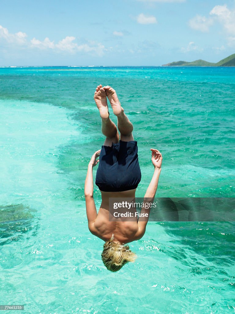 Young Man Cliff Diving