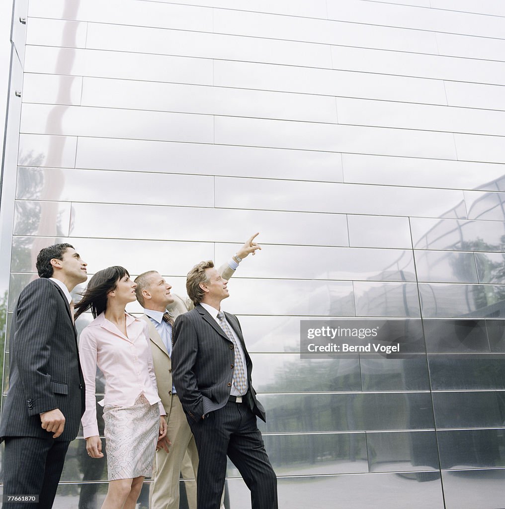 Businesspeople Looking Up at Something