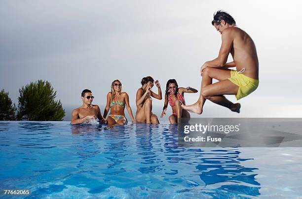 man doing a cannonball - cannon ball pool stock pictures, royalty-free photos & images