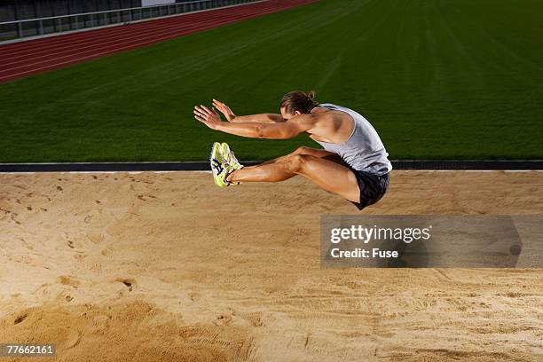 man long jumping - long jump stock pictures, royalty-free photos & images