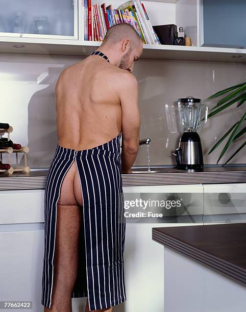 nude man wearing an apron - bare bottom stock pictures, royalty-free photos & images