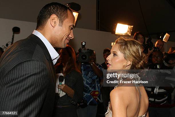 Dwayne "The Rock" Johnson talks with actress Sarah Michelle Gellar as they arrive at the "Southland Tales" screening during AFI FEST 2007 presented...