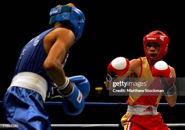 Amnat Ruenroeng of Thailand boxes Harry Tanamor of the Philipines during their semifinal bout in the 48kg division of the AIBA World Boxing...