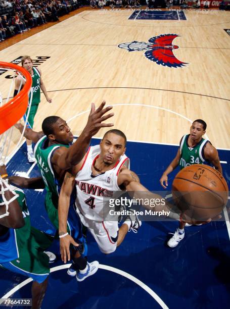 Acie Law IV of the Atlanta Hawks shoots a layup past Eddie Jones of the Dallas Mavericks during a game on November 2, 2007 at Philips Arena in...